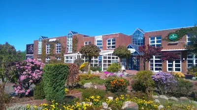 Ein Garten an der Unterkunft Hotel am Hasengarten