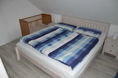 Ein Bett oder Betten in einem Zimmer der Unterkunft Ferienwohnung Herzmuschel
