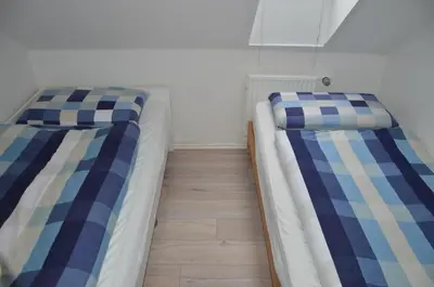 Ein Bett oder Betten in einem Zimmer der Unterkunft Ferienwohnung Herzmuschel