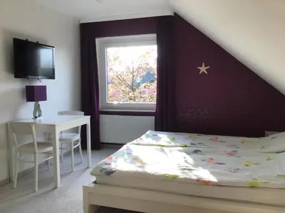 Ein Bett oder Betten in einem Zimmer der Unterkunft Ferienwohnung Seestern