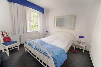 Ein Bett oder Betten in einem Zimmer der Unterkunft Ferienanlage Duhnen Haus 19