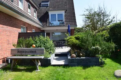 Ein Garten an der Unterkunft Hotel Haus am Meer