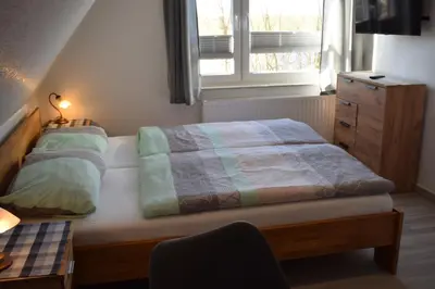 Ein Bett oder Betten in einem Zimmer der Unterkunft Hotel Haus am Meer