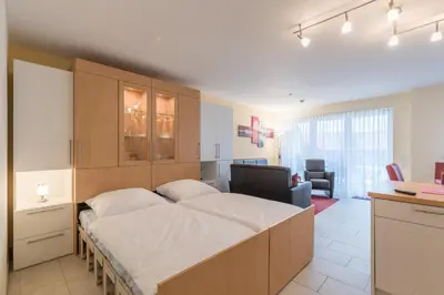 Ein Bett oder Betten in einem Zimmer der Unterkunft Dünenflair Wohnung 2