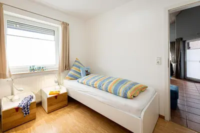 Ein Bett oder Betten in einem Zimmer der Unterkunft Ferienhaus Seebär
