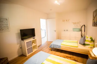 Ein Bett oder Betten in einem Zimmer der Unterkunft Strandchalet Elmo II