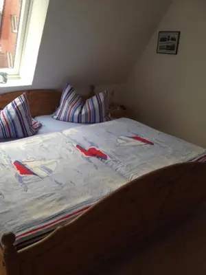 Ein Bett oder Betten in einem Zimmer der Unterkunft Ferienwohnung Kremer