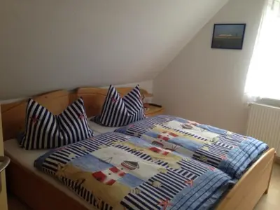 Ein Bett oder Betten in einem Zimmer der Unterkunft Ferienwohnung Kremer