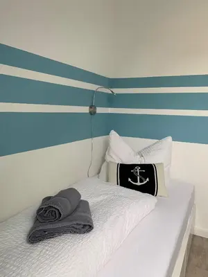 Ein Bett oder Betten in einem Zimmer der Unterkunft Wohnung 