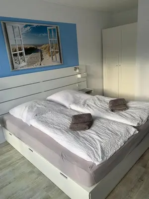 Ein Bett oder Betten in einem Zimmer der Unterkunft Wohnung 