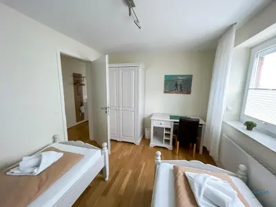Ein Bett oder Betten in einem Zimmer der Unterkunft Haus Blue Ocean Wohnung 8