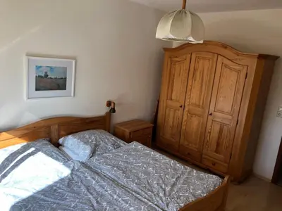 Ein Bett oder Betten in einem Zimmer der Unterkunft Ferienwohnung Op'n Rugenbarg 70 OG