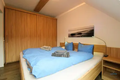 Ein Bett oder Betten in einem Zimmer der Unterkunft Residenz Hohe Lith Wohnung 28