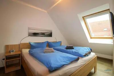 Ein Bett oder Betten in einem Zimmer der Unterkunft Residenz Hohe Lith Wohnung 28