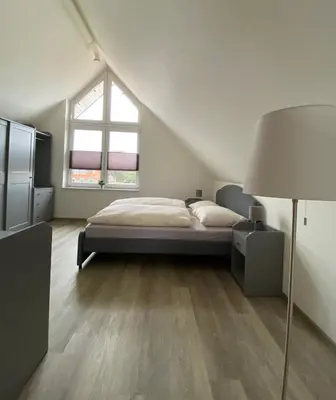 Ein Bett oder Betten in einem Zimmer der Unterkunft MarC5 Hotel Cadenberge