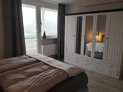 Ein Bett oder Betten in einem Zimmer der Unterkunft Ferienwohnung für große Familien im Haus Akunak