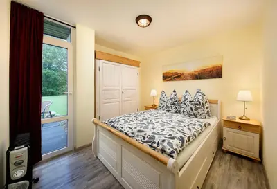 Ein Bett oder Betten in einem Zimmer der Unterkunft KNAUS Campingpark Wingst
