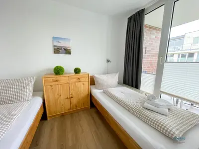 Ein Bett oder Betten in einem Zimmer der Unterkunft Residenz Hohe Worth Wohnung 307