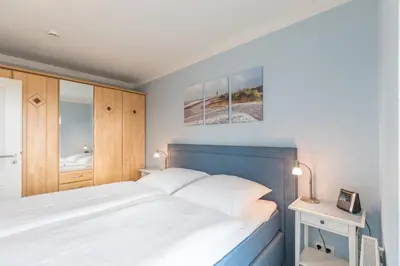 Ein Bett oder Betten in einem Zimmer der Unterkunft Duhner Seedüne Wohnung 7