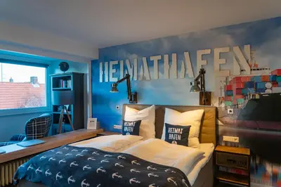 Ein Bett oder Betten in einem Zimmer der Unterkunft Heimathafen