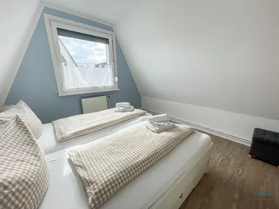 Ein Bett oder Betten in einem Zimmer der Unterkunft Ferienhaus am Ringwall 16