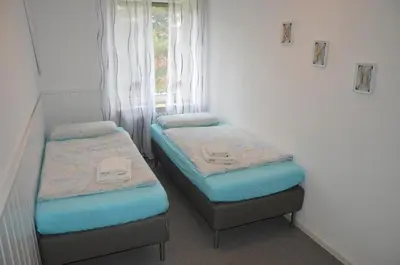 Ein Bett oder Betten in einem Zimmer der Unterkunft Ferienwohnung Meerglück