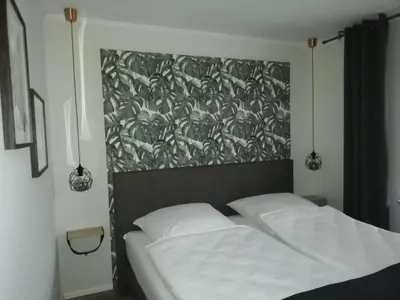 Ein Bett oder Betten in einem Zimmer der Unterkunft Wohnung Enjoy