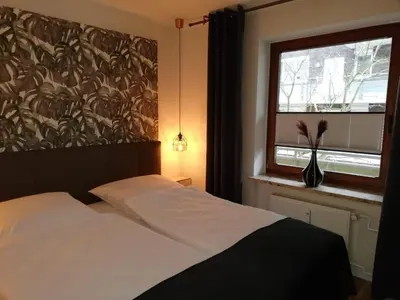 Ein Bett oder Betten in einem Zimmer der Unterkunft Wohnung Enjoy