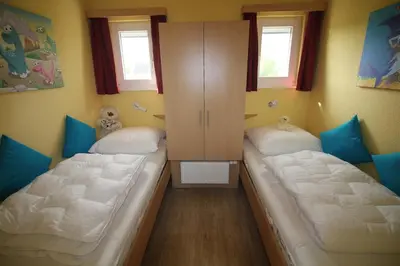 Ein Bett oder Betten in einem Zimmer der Unterkunft Ferienhaus Nixe7