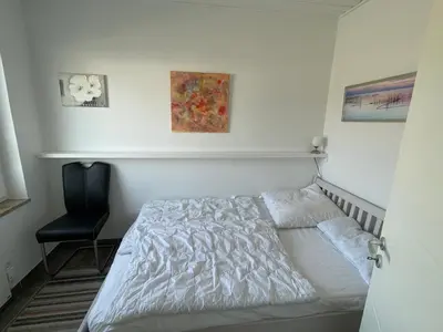 Ein Bett oder Betten in einem Zimmer der Unterkunft Gleich hinterm Deich 4