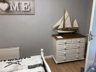 Ein Bett oder Betten in einem Zimmer der Unterkunft Lieblingsplatz - Ferienwohnung Verse