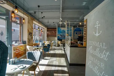 Ein Restaurant oder anderes Speiselokal in der Unterkunft Hotel Stadt Cuxhaven