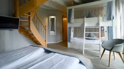 Ein Bett oder Betten in einem Zimmer der Unterkunft Hotel Am Medemufer