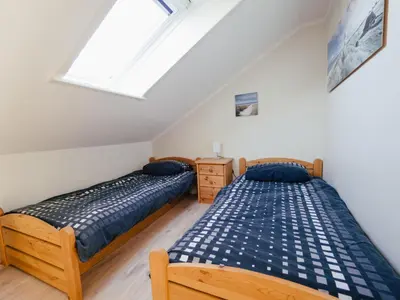 Ein Bett oder Betten in einem Zimmer der Unterkunft Beachcomber House B