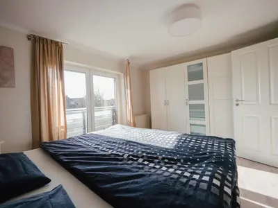 Ein Bett oder Betten in einem Zimmer der Unterkunft Beachcomber House B