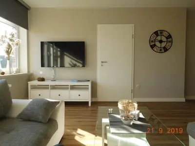Ein Sitzbereich in der Unterkunft Ferienwohnung Zwischen Marsch u. Geest