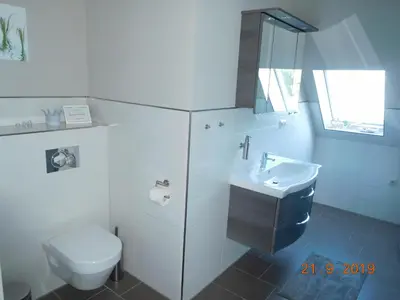 Ein Badezimmer in der Unterkunft Ferienwohnung Zwischen Marsch u. Geest