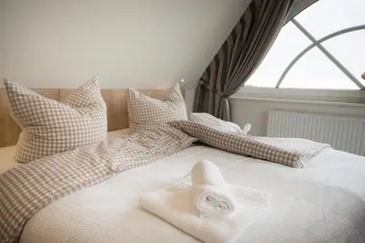 Ein Bett oder Betten in einem Zimmer der Unterkunft Hotel Nige Hus