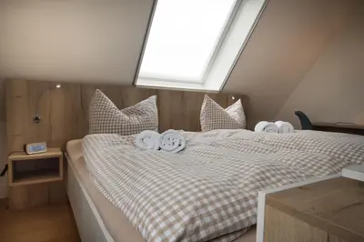 Ein Bett oder Betten in einem Zimmer der Unterkunft Hotel Nige Hus
