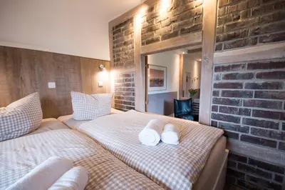 Ein Bett oder Betten in einem Zimmer der Unterkunft Hotel Nige Hus