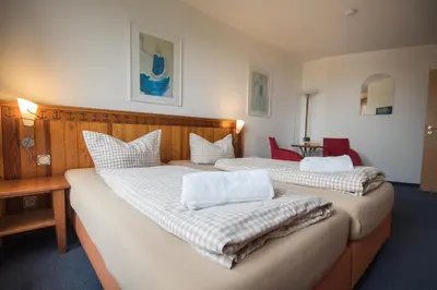 Ein Bett oder Betten in einem Zimmer der Unterkunft Hotel Nige Hus