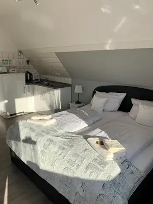 Ein Bett oder Betten in einem Zimmer der Unterkunft Haus Kaiser Ferienwohnung und Appartementvermietung