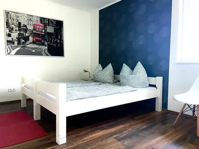 Ein Bett oder Betten in einem Zimmer der Unterkunft Ferienhaus Malte Büsch