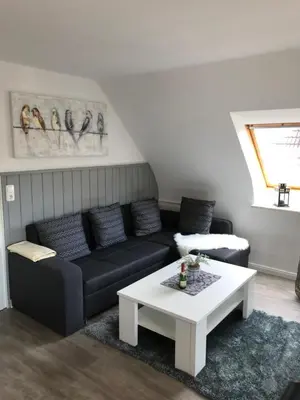 Ein Sitzbereich in der Unterkunft Haus Andrea -Wohnung oben