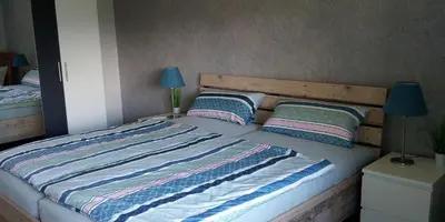 Ein Bett oder Betten in einem Zimmer der Unterkunft Ferienwohnung Schwiemann, Erdgeschoss