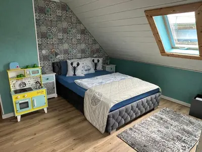 Ein Bett oder Betten in einem Zimmer der Unterkunft Ferienwohnung Herrlichkeit