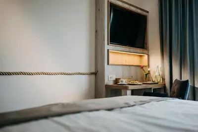 Ein Bett oder Betten in einem Zimmer der Unterkunft Hotel Alter Muschelsaal