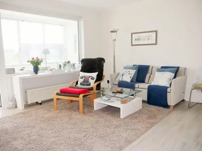 Ein Sitzbereich in der Unterkunft Seedeich Apartment