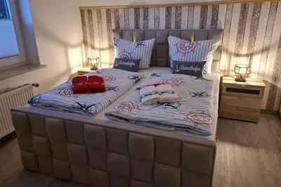 Ein Bett oder Betten in einem Zimmer der Unterkunft Heimathafen