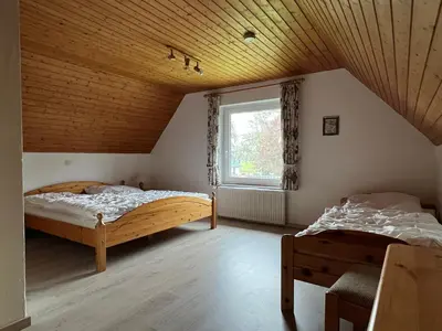 Ein Bett oder Betten in einem Zimmer der Unterkunft Ferienhaus Küste